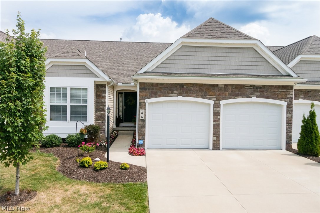 Absolutely stunning condo in North Point at Hunters Crossing - with a first floor master! This one comes with all the bells and whistles, upgrades galore, and tons of bright and cheery living space. Only 4 years young - this is a rare one you can literally move into without doing a thing! The main level boasts a huge great room w/vaulted ceilings, gas burning fireplace with the flick of a switch, and 4 skylights. This welcoming space has a modern open concept to the kitchen and dining room, and sliders to a trex deck w/vinyl privacy fencing (low maintenance!). The kitchen is appointed with high end maple cabinets, ample counter and storage space, quartz counter tops, and gorgeous wood laminate flooring - which extends through the dining room, foyer, and hallway. The first floor master suite also has a vaulted ceiling w/ceiling fan, two closets (one walk-in!) master bath w/dual sinks, garden tub, and full shower. The main level is completed by another first floor bedroom or office,