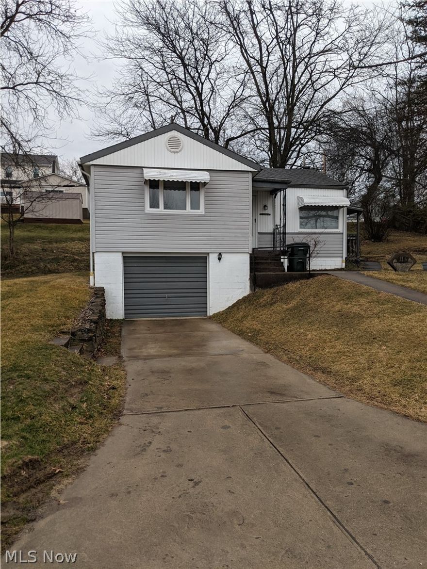 Very well keep two-bedroom home with nice size living room, dining area. kitchen has range and refrigerator. Two bedrooms and a clean and functional bathroom. In the basement there is a large room that could be a family room. Also washer and dryer are there. Nice size workshop and a one car garage. No pet policy. Side porch is covered and is nice for a cookout or just siting and relaxing. One car garage is very convenient for putting your car away out of the elements. The rent is $950.00 per month, with $100.00 to cover the cost of water and sewer. If the water and sewer exceeds $75.00, the tenant is required to pay the difference. All other utilities will be in the tenants name. Landlord states that during heavy rains the south east corner of the basement gets some water. The two car garage to the left of the house is not included in the rental.