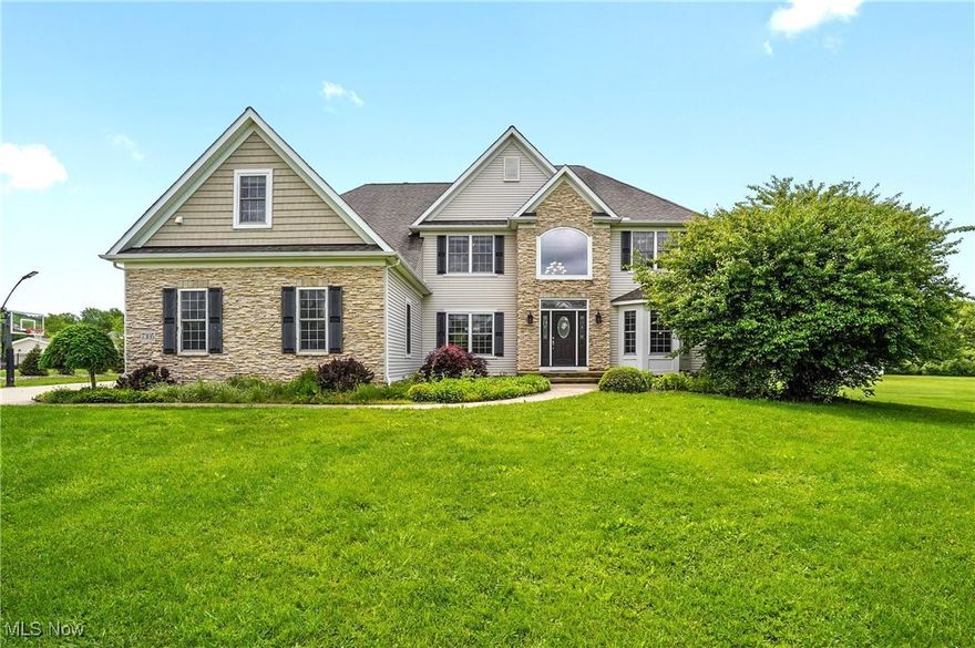 Welcome to this stunning 5 bedroom, 5 ½ bath, 3 car garage colonial with All NEW carpet upstairs! Set on 2.35 picturesque acres in one of Concord Twp's most sought-after neighborhoods, with private community trails and direct access to Jordan Creek Park-complete with wooded walking paths and a ninja course for kids. Step through the welcoming foyer with a view of the sun-filled, two-story great room with a fireplace and wall of windows framing the serene backyard along with an entertainment center perfect for making a house a home. The open-concept design flows into a formal dining area with beamed ceilings and a stately office with a bay window. The heart of the home is the newly remodeled chefs kitchen featuring a 9-foot granite breakfast island, extra-wide 6-burner gas stove, built-in desk, and stylish LVT flooring throughout the first floor. A newly added mudroom with its own entrance keeps life organized with plenty of shelving and large area for a family "drop zone". The first-floor guest suite includes a private full bath-perfect for visitors or multi-generational living. The luxurious primary st boasts its own fireplace, wet bar, sitting area, and spa-like bathroom with his/her sinks, oversized tile shower, glass doors, multiple shower heads, bench seating, and plantation shutters. A huge DREAM walk-in closet doubles as a laundry room for ultimate convenience. Another upstairs bedroom includes a newly added full ensuite bath perfect for teen privacy or out of town guests. The finished basement offers even more living space with a full bath, mirrored workout room, living area and versatile bonus room. Entertain year-round under the newly constructed covered patio, complete with stone fireplace, outdoor TV, built-in grill and fridge -a true escape! Detailed woodwork, intricate ceiling finishes, many renos and whole home security system w/ window sensors and outdoor cameras elevate the home's timeless elegance! This home is ready for its next chapter! Must See!