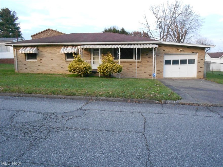 Delightful Brick Ranch situated on level fenced lot and located in the heart of North Parkersburg.  Close to schools, shopping, Library, bus line, YMCA, City Park and more. Larger noted BA has the Laundry Area. This home offers great potential for Buyers of all age groups. Hardwood floors under carpeting.  Needs some TLC. Attached Garage 26' x 13'    Home is being Sold "As Is."