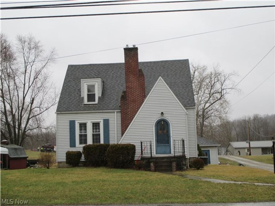 Beautiful wood work and hard wood floors, living room, kitchen with breakfast nook, formal dinning room on main floor 2 beds and full bath up. Detached garage, full basement, level lot. Lots of charm and character here. Just out side Crooksville close to schools.