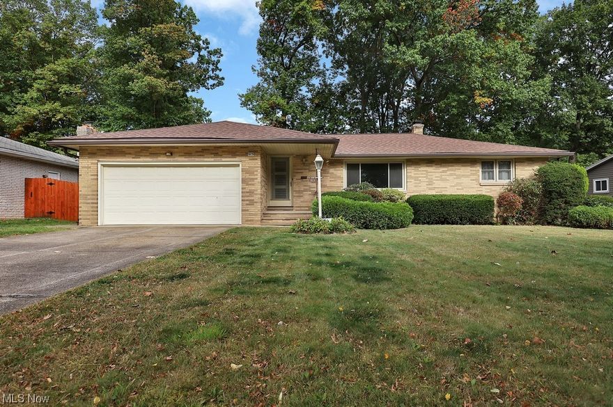 Welcome home to this beautiful all Brick Ranch in the Overlook Subdivision within minutes of downtown Cleveland and the recently renovated John Glenn Park! So many wonderful features inside & out! Walk in and feel right at home. Spacious living room boasts beautiful wood flooring and a large window perfect for natural light. This space then opens to the large Kitchen that features all white cabinets, added shelving and connects to the dining room. The main floor features 3 bedrooms that each boast beautiful hardwood floors and ample closet space.  The full bathroom down the hall was fully renovated in 2023 and features a beautiful tile shower and flooring. The half bathroom was also recently remodeled and features a large mirror and vanity. The family room provides additional space on the first floor and opens up to the large back yard. Down to the basement you will find a bar with a very spacious open area. There is also a full kitchen with a stove, refrigerator and sink. The basement is finished off by the full workshop and laundry area. Do not pass on your opportunity to own this wonderful home! Schedule a tour today!