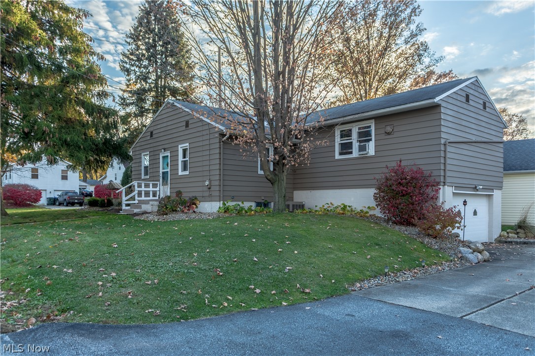 Hurry come check out this beautiful ranch home in the desirable Cuyahoga Falls! This home starts with newly painted siding with all new beautiful low maintenance mature hydrangeas for gorgeous curb appeal. When you come inside you will notice the freshly painted living room with original wood floors. You have a large newly remodeled bathroom with ceramic tile. Just wait until you see the extra large master bedroom with 3 closets! When you go downstairs you have a large built in workshop area. This home is a must see home!