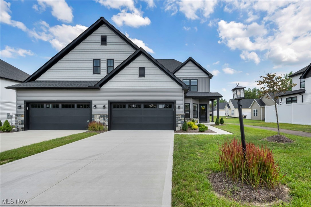Welcome to 8761 Windfall Ct, where refined craftsmanship meets
everyday comfort in North Royalton’s premier Windfall Reserve
community. With over 2,500 sq ft this newly built 4-bedroom, 3.5-bath
home is more than just a place to live—it’s a sanctuary designed for
effortless living and elevated style. From the moment you step through
the door, you’re greeted by soaring two-story ceilings and a dramatic
wall of windows that bathe the great room in natural light. The heart
of the home is a designer kitchen featuring quartz countertops,
soft-close cabinets, stainless steel appliances, and a large center
island perfect for gathering with family and friends. The luxurious
first-floor primary suite offers a peaceful escape, complete with a
custom tiled spa shower, frameless glass door, dual vanity, and
generous walk-in closet. Upstairs, two of the three additional
bedrooms enjoy their own private en-suite baths—ideal for guests,
teens, or multi-generational living. With thoughtful touches like
first-floor laundry, a heated 1,400+ sq ft crawl space for endless
storage, and a quiet cul-de-sac setting, this home is both elegant and
practical. Step outside to a private patio enclosed by a vinyl privacy
fence and enjoy evenings with zero maintenance, thanks to an HOA that
handles lawn care and snow removal. Just minutes from shopping,
top-rated schools, and the tranquility of nearby parks—this is the
perfect blend of luxury, convenience, and community.
