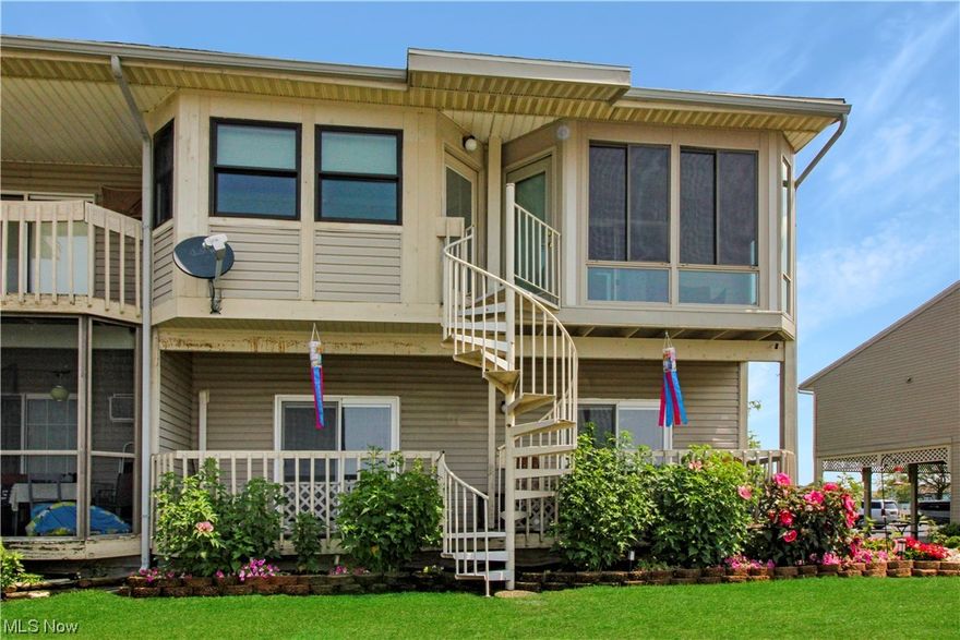 2nd floor Green Cove unit with great views of the Marina and your dock at the door! Ample living space opens to the kitchen and spiral steps downstairs. The large bedroom has built-in closets and additional storage, including a stackable washer and dryer. The home has an electric heat pump and baseboard heat with added central air! Lofted air for overflow guests, too. Carport and storage area too. This association offers amenities, tennis courts, a pool, and lots of green space. Call today to take a look. Invest in your Lake Erie Place today!