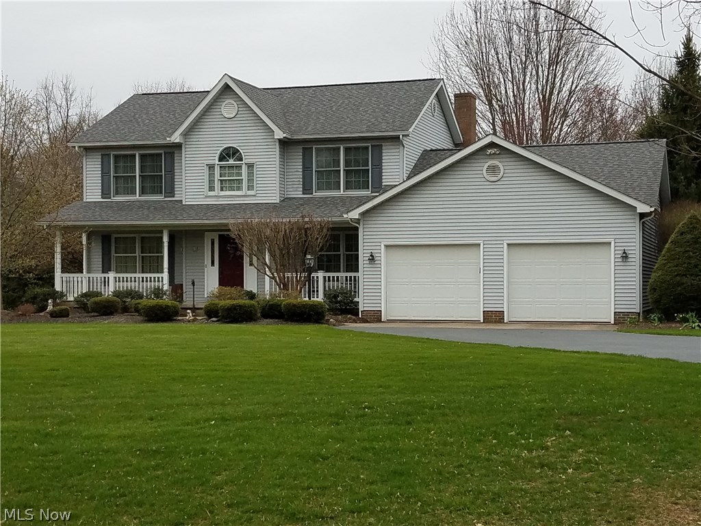 Original owner offering this beautiful colonial 4 bedroom home with quiet country living within minutes of shopping and Route 62. This quality built 2 story colonial home with beautiful foyer and stairway, with access to living room and library on each side. The library has beautiful wood, built in bookshelves and a work station with book shelves above it. The dining room, kitchen and family room face the lovely private backyard. The kitchen is open to the family room warmed by a fireplace , with an efficient heat producing electric insert. Upstairs leads to 4 bedrooms including ceiling fans in each room. The master suite has a sitting area, large double walk in closet and bathroom with 2 vanities and sinks. One bedroom includes built in cupboards making it ideal for a nursery, sewing room or game room. Choose to sit on the front porch, in the sunroom or on the large deck (10x15) to enjoy all of the beautiful perennial landscape surrounding the home. The exterior is maintenance free wi