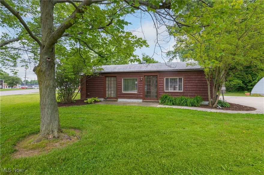 This modern, minimalist 2-bedroom, 1-bath arched cottage blends unique Quonset-style architecture with practical comfort on a spacious 0.43-acre lot. Inside, you'll find a bright, updated kitchen with stainless steel appliances, generous cabinet storage, and plenty of counter space—all on one convenient level. The detached studio garage offers flexible space for a workshop, creative studio, or extra storage. A new concrete driveway and pad add function and curb appeal, while professional landscaping and upgraded insulation throughout ensure comfort and efficiency year-round. Vinyl windows and clean, contemporary finishes complete this one-of-a-kind home with character and versatility.
