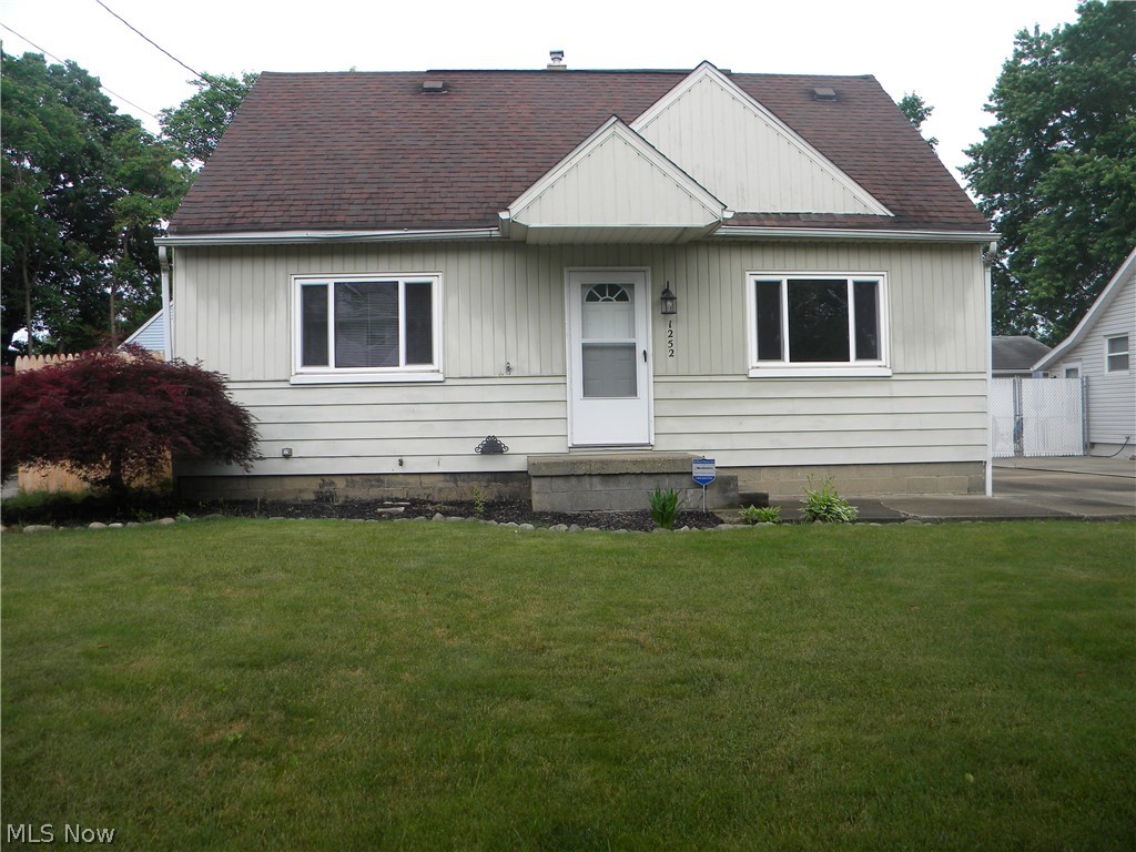 Beautiful move in ready 3/4 bedroom cape in North Akron. Kraftmaid cabinets in the kitchen with pullout shelves and tile flooring. Full bathroom has a tiled shower all the way to the ceiling and vent fan. Finished basement with rec room and one bedroom. Two car detached garage with a large fenced in yard and stoned patio for your summer BBQ's. Call to schedule a showing today.