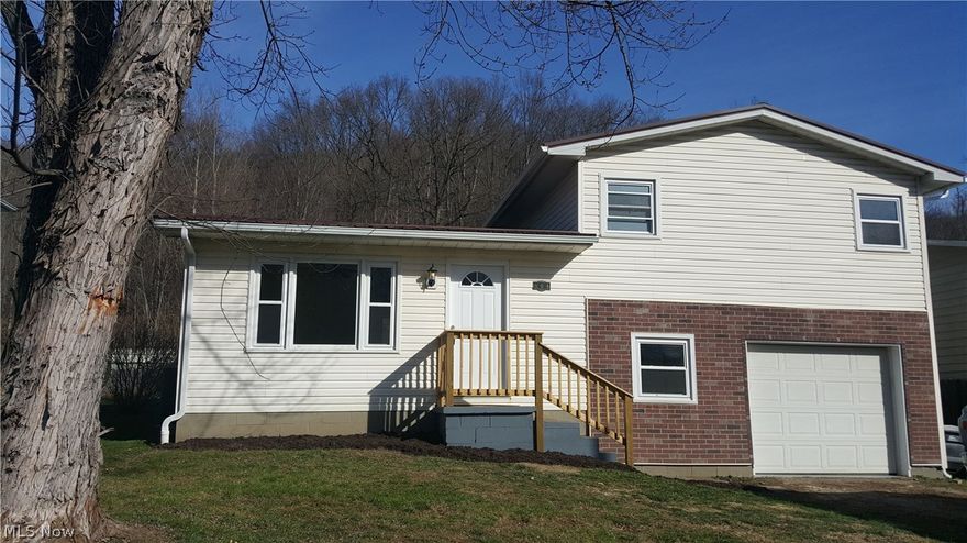 Completely remodeled split level home with 3 bedrooms and a brand new kitchen. Brand new furnace and central air. Brand new metal roof. Everything has been done and this home is ready for you to move in to. Large yard with woods to rear gives it a country feel.