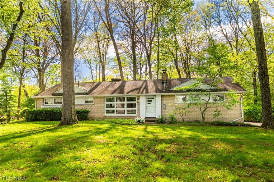 Nestled on a stunning nearly one-acre double wooded lot in Perry Township, this charming brick ranch offers the perfect blend of timeless character, warmth, and privacy. Surrounded by mature trees and peaceful scenery, this home feels like your own private retreat while still being conveniently located close to everything. Step inside to a spacious great room filled with abundant natural light, rich hardwood floors, and a cozy fireplace that creates an inviting atmosphere from the moment you enter. The open eat-in kitchen flows seamlessly into the breathtaking sunroom, which leads to a spacious back deck. This bright and airy space is wrapped in windows and highlighted by a second fireplace, making it the ultimate place to relax, unwind, or entertain while overlooking the serene backyard setting. Offering 3 spacious bedrooms and 1.5 bathrooms, this home provides comfortable living with endless possibilities. The fully finished basement features a dedicated laundry area, a half bath with a separate shower area and an expansive additional living space ideal for entertaining, a recreation room, a home office, or separate living quarters. Enjoy effortless indoor-outdoor living with multiple access points leading to the peaceful outdoor spaces. Completing the home is a spacious two-car garage with convenient basement access. From the picturesque wooded setting to the inviting interior and versatile living spaces, this exceptional property is truly one-of-a-kind. Schedule your showing today!