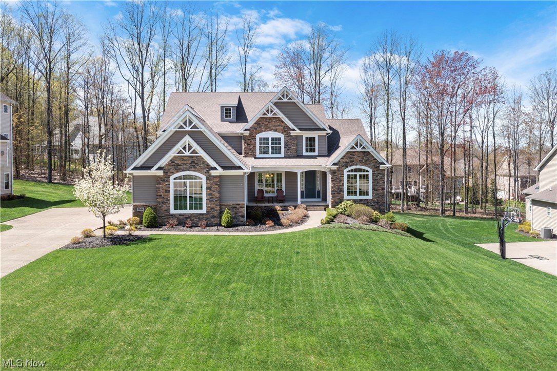 Impeccably designed and meticulously maintained, this luxurious home is located in Mountainside Farms. This subdivision is situated on top of a ridge surrounded by scenic wooded areas that offers tranquility, beauty and peace. Attention to detail defines these 3342 square foot cape cod home. Typical of the award winning ProBuillt homes, the house has fine custom cabinetry, crown moldings, elaborate wainscot paneling, gleaming hard wood floors and a well-designed open floor layout. The first floor has a gracious foyer, paneled dining room, office, laundry room and large two-story family room with a wall of windows and a stone fireplace. A grand arched opening leads to a fabulous chef’s kitchen that includes high end appliances, walk-in pantry, and granite countertops. The first floor primary bedroom suite includes a large and glamerous ensuite bathroom. Upstairs you will find a loft and 3 spacious bedrooms with walk-in closets and private bathrooms. The walk-out basement has plenty of