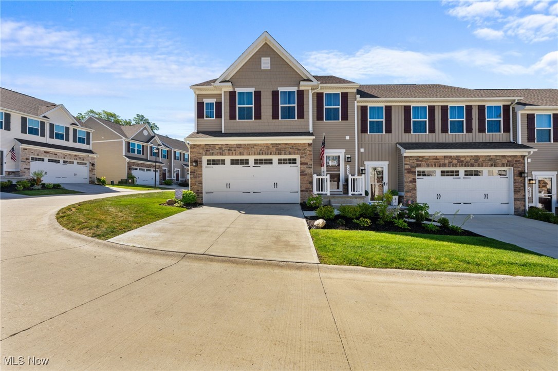 Stunning 2023 built townhome in the Hillshire Woods Development in Concord Twp! This spacious 4 bedroom, 3.5 bath home offers over 2,500 sq ft of finished living space, including a fully finished basement – ideal for multi-generational living or guests. The main level features a bright, open floor plan with a large living room, upgraded kitchen with stone countertops, stainless steel appliances (included), pantry and a dining area with slider to the 12x12 composite deck and stamped concrete patio. A perfect space for outdoor entertaining. Entry foyer with half bath and attached 2 car garage with epoxied floor and extra storage. Upstairs, you’ll find a luxurious primary suite with two walk-in closets and custom tiled shower, two additional bedrooms, full bath, convenient laundry and a loft area, ideal for an office nook. The finished basement includes a large rec room, 4th bedroom with egress and a full bath! Move-in ready, better than new and packed with upgrades, this one has it all! Schedule your showing today!