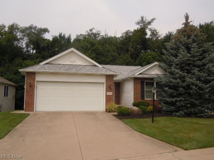 Very Rare and Very Beautifully Maintained Parma Hts. Ranch Cluster Home Offering You One Floor Easy Living! You Will Be Wowed Upon Stepping Into the Foyer and Seeing the Huge Living Room With Its Volume Ceilings, Gas Fireplace and Tall Windows. The Eat-In Kitchen Features Lots Of Cabinet and Counter Space, All Appliances, Volume Ceilings and Steps Out Onto A Trex Deck!! The Deck Features A Sunsetter Awning and  Leads Down To Your Private Stamped Concrete Patio. Great For Outdoor Entertaining! The Master Suite Is Impressive With Vaulted Ceilings, Walk-In Closet and Private Bath With Step-In Shower. The Laundry Room Is On the Main Floor, Comes With Washer & Dryer and Leads To Your Walk-Out Basement. Gorgeous Full Bath In Basement With Ceramic Tile Flooring. The Roof Is One Year Young and Gutters Feature Gutter Guard. Call For A Showing Today!