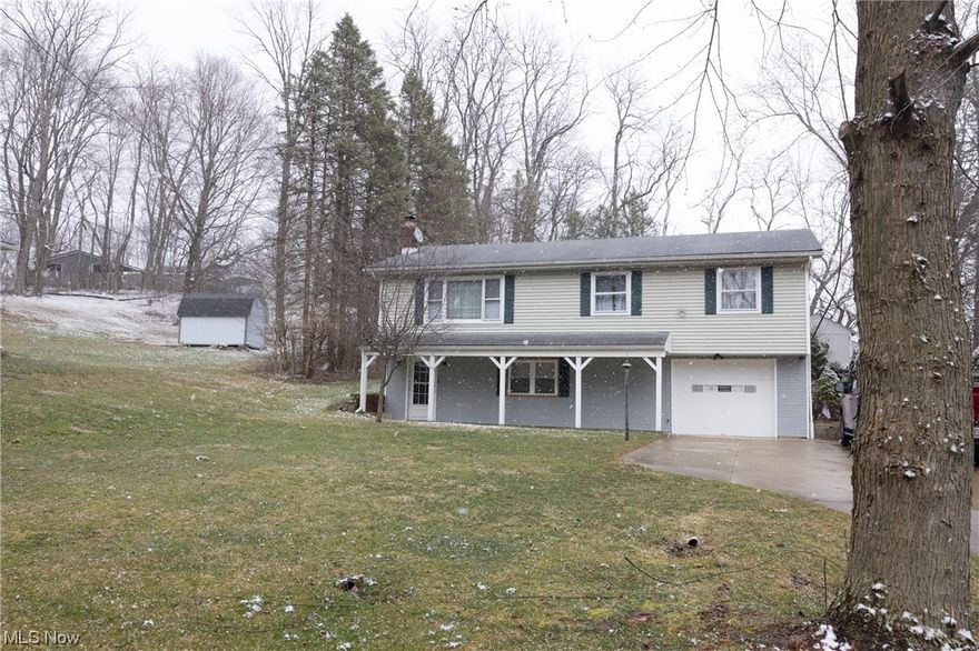 Looking for a spacious, well-maintained raised ranch in Akron, Ohio? Look no further than 4643 Timothy Dr! This beautiful home is situated on a large .76-acre lot in the highly sought-after Green School District. Inside, you'll find hardwood floors throughout the bedrooms and living room, creating a warm and inviting atmosphere. The lower level boasts a cozy wood-burning fireplace, perfect for relaxing on cold Ohio evenings. Additionally, there is a workshop and utility room located in the lower level, providing ample space for storage and hobbies. With a 1-car garage and plenty of yard space, this home offers all the convenience and comfort you need. Whether you're looking to relax in peace or spend quality time with loved ones, this home is the perfect choice. Don't miss your chance to make it yours - schedule a viewing today!