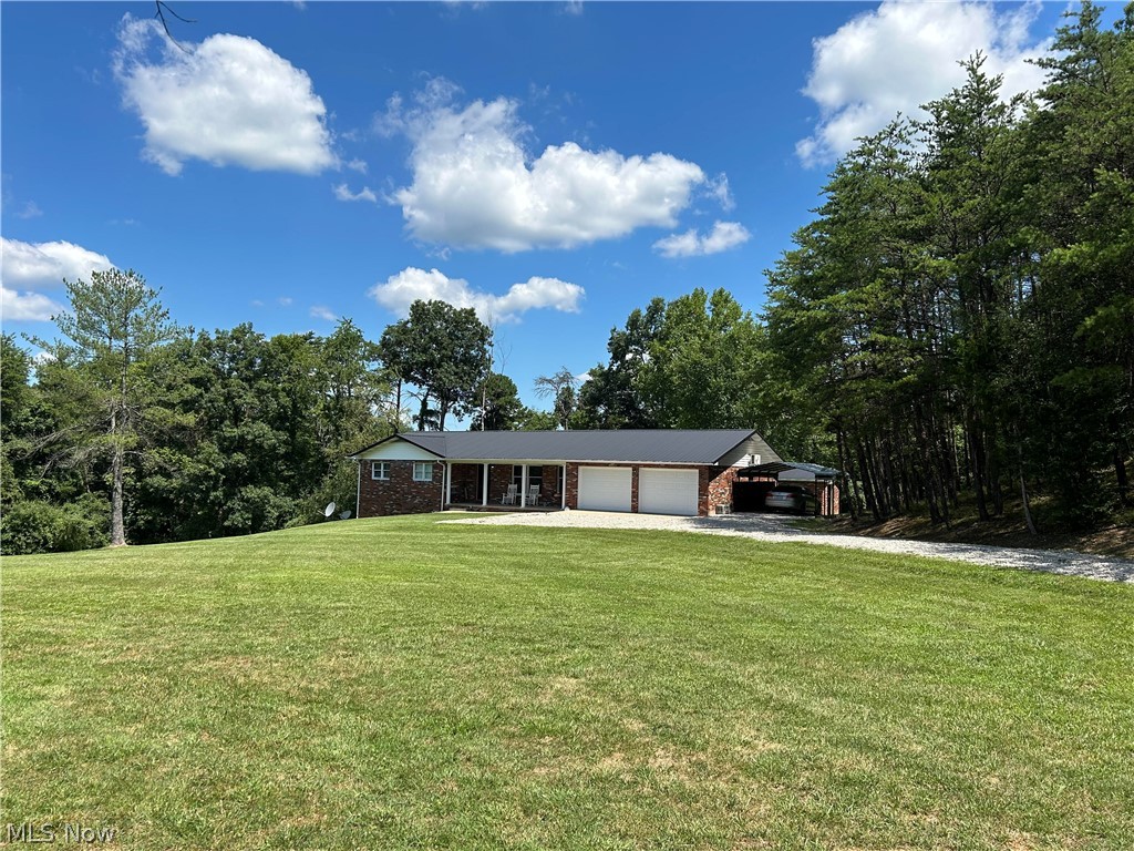Private, Move-In-Ready Brick ranch consists of 4.6 private acres offering mixed woods and cleared yard and garden areas and offers 1360 sf, Living room, Kitchen and Dining Room, 3 bedrooms and bath on main floor. 1360 sf partially finished walk-out basement-recreation area, utility, new full bath. Double garage-split heat and cool unit in garage . Covered front porch, newer deck with new patio doors to deck. New granite countertops in kitchen and refinished cabinets. Laminate flooring throughout main level, except bath which is newly tiled. Kitchen appliances convey. Basement studded + electric-ready to finish. City water, private septic-garden space-wildlife- only 4 miles from Rt. 35.