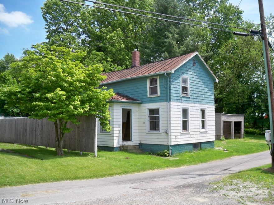 Two-story house on 3 parcels. Needs TLC