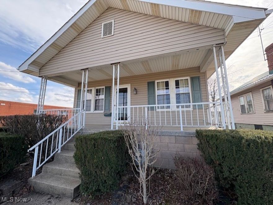 Adorable home on Sunset Blvd. Home has a driveway out front and access from the alley in back. Back yard has nice vinyl fencing and room to park 2 cars. Much updating has been done. Wall was opened up between kitchen and dining room making a nice flow on main floor. Large room was added to the back of home and was used as a large 3rd bedroom but if 2 bedrooms are all you need, this would make an awesome family room. When addition was put on, they also added a large walk-in closet and an additional bathroom. There are sliding doors in this room to a deck outside that faces the back yard. Please don't go on deck!  Has some weak spots. Fireplace in living room is capped off. 200-amp breaker box in basement. Nice Rec room in basement with closet. Stove in kitchen can stay as well as the kitchen table and freezer in basement. Parking can be out front in driveway to detached garage OR parking in back off alley and then entrance to nice fenced in area for pets or kids. Entrance through fence to basement rec room.