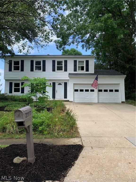 Crestdale Estates Colonial. Updated and freshly painted throughout 4 BR 2.5 bath colonial. The beautiful hardwood flooring greets you as you enter the foyer. The newer windows allow the natural lighting to filter throughout the house lighting the living and dining rooms as you walk through. The kitchen features cherry cabinets, stainless corner sink and ample counter space and opens to the eating area and family room. You will love the Great room addition with windows that surround the room. Perfect for watching the birds, butterflies and an occasional deer or two. Beautiful marble fronted fireplace creates a sense of peace and comfort. There are doors to the private covered patio. There is a shed for storage of your seasonal tools, mower, etc. The half bath off of the foyer completes the first floor. The spacious master bedroom features a walk in closet and vanity dressing area and a step in shower with a waterfall door. The main bath has a new vanity with double sink, new fixt