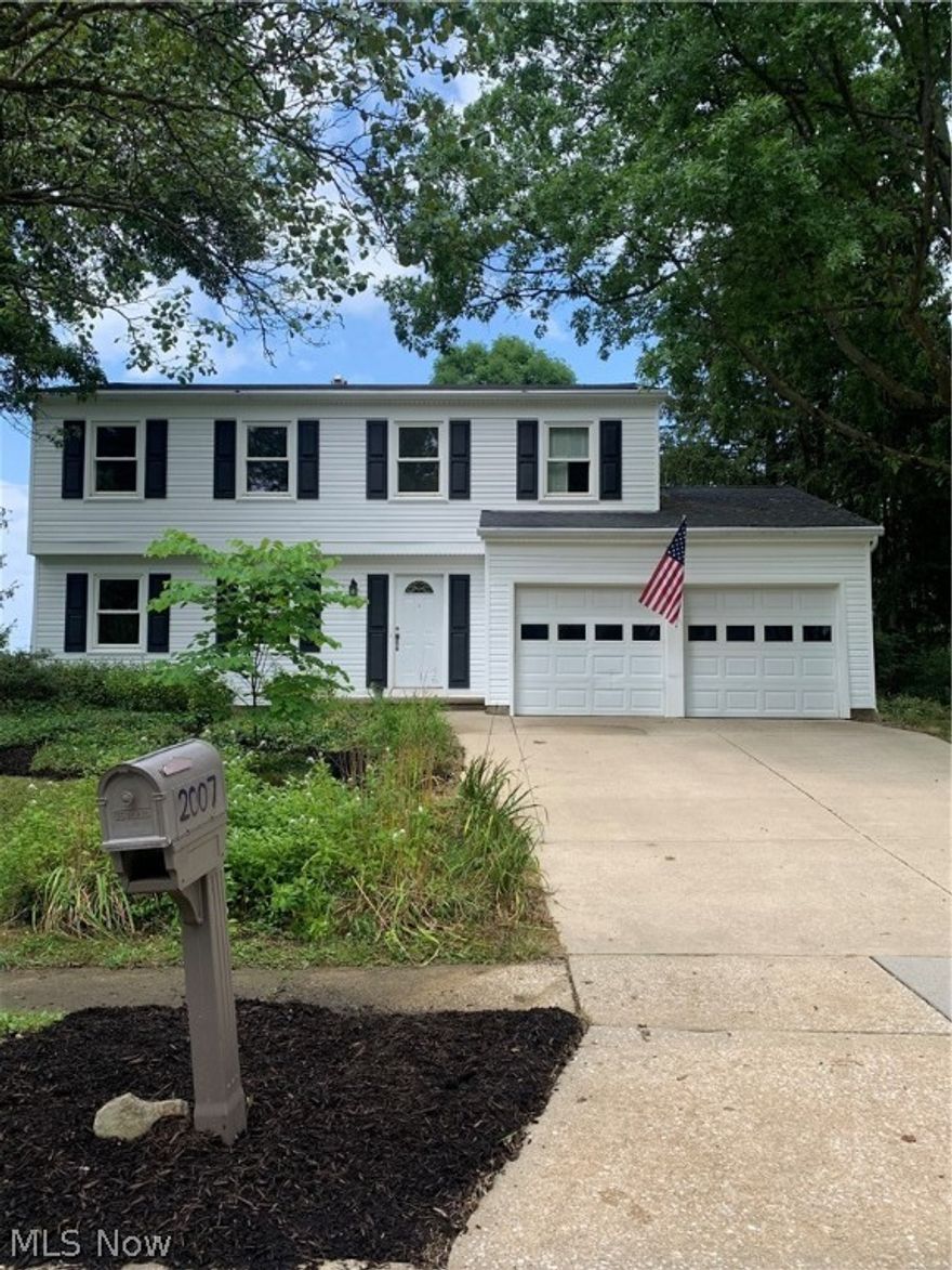 Crestdale Estates Colonial. Updated and freshly painted throughout 4 BR 2.5 bath colonial. The beautiful hardwood flooring greets you as you enter the foyer.  The newer windows allow the natural lighting to filter throughout the house lighting the living and dining rooms as you walk through.  The kitchen features cherry cabinets, stainless corner sink and ample counter space and opens to the eating area and family room.  You will love the Great room addition with windows that surround the room. Perfect for watching the birds, butterflies and an occasional deer or two.  Beautiful marble fronted fireplace creates a sense of peace and comfort. There are doors  to the private covered patio.  There is a shed for storage of your seasonal tools, mower, etc. The half bath off of the foyer completes the first floor. The spacious master bedroom features a walk in closet and vanity dressing area and a step  in shower with a waterfall door. The main bath has a new vanity with double sink, new fixt
