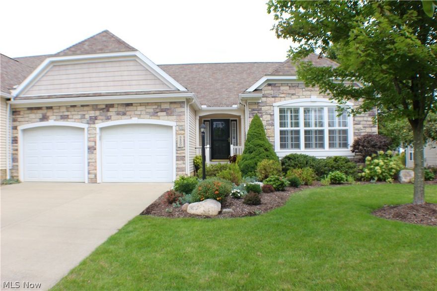 Welcome to this exceptional and thoughtfully designed ranch condominium.  The owners enhanced the home's interior with their attention to detail during construction and included many additional features throughout. As you enter the open foyer, the soaring ceilings in the great room, bright with filtered light from the skylights and wall of windows, greet you.  As you walk through, you'll notice the pond and fountain just off of the brick paver patio.  The vaulted ceiling flows through to the dining area and kitchen. Beautiful custom cabinetry, granite counter tops, stone backsplash and stainless steel appliances showcase the kitchen.  Just steps away is the first floor laundry with additional cabinetry and stationary sink. The master bedroom also features the vaulted ceiling and windows overlooking the pond and landscaped rear yard.  The master bath has double sinks a wall of mirrors and an amazing oversized shower with multiple shower heads. 9 x 7 walk in closet, too.  Off the foyer i