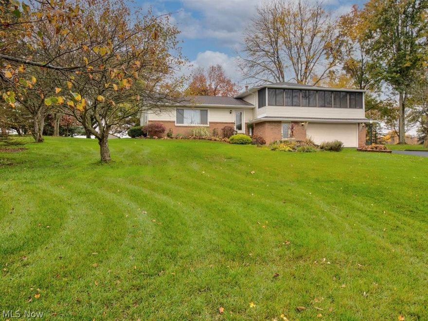 WOW, what a house with too many updates to list here.(see last picture for the list)  Midview Schools 3 bedroom / 2.5 bath home on 2.3 acres that borders the Lorain County Metro Parks.  The kitchen offers a recent remodel (3 years) including granite countertops and Oak cabinets with Amish made cabinet doors. Bathrooms were remodeled 2 years ago. Nature stone sidewalks. Enjoy nature with the Pergola covered  back patio that is also nature stoned. Heated two car garage. Sit on the 2nd level screened-in front porch with 3 skylights and enjoy the sights.  Metro park land behind you should insure many many years of seeing wide open spaces. 20 x 17 storage building out back for all your yard and gardening needs.  All appliances stay with the home and all 3 bedroom have ceiling fans installed.