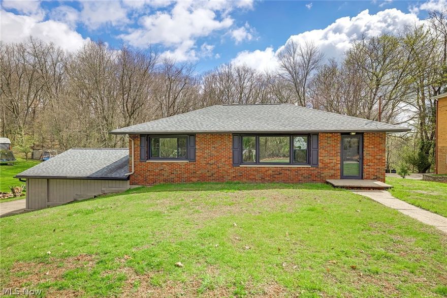 Welcome to this beautifully remodeled ranch home located near the desirable Portage Lakes area, offering convenient lake access and a peaceful, private setting on over half an acre.

This charming brick and siding home has been completely updated with modern finishes throughout. Step inside to a spacious living area featuring built-in storage—perfect for both relaxing and entertaining. Brand-new luxury vinyl plank (LVP) flooring flows seamlessly throughout the entire home, adding durability and style.

The fully renovated kitchen boasts all-new cabinetry, sleek countertops, and updated appliances, creating a fresh and functional space for cooking and gathering. The home includes three generously sized bedrooms with new carpet and two fully updated bathrooms, each thoughtfully designed with contemporary fixtures and finishes.

Enjoy outdoor living on the brand-new deck just off the back porch, overlooking a private, tree-lined yard that offers both space and serenity.

With its extensive renovations, modern upgrades, and prime location near Portage Lakes, this move-in-ready home is a rare find. Don’t miss your opportunity to enjoy lake living with the comfort of a completely updated home.