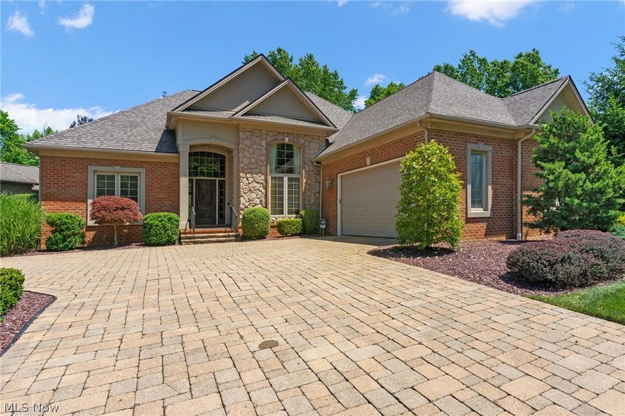 Elegance abounds this 2500+ square foot all brick property in Villa Di Tuscany. The first level includes a stunning kitchen with granite countertops and Bosch stainless appliances; a massive great room, dining room, and foyer area with 13 ft ceilings and fireplace; sun room; laundry room; 1/2 bath; 2 bedrooms with a jack and jill bath; and a huge master bedroom with a double tray ceiling and master bath with jetted soaking tub, separate tiled shower, and spacious walk in closet. A second level plays host to the fourth bedroom and additional full bath. Amenities include hardwood floors, built in blinds in the windows, a brand new roof, and upgrades galore. Enjoy the outdoors from the custom brick paver patio with waterfall. A full basement with finished full bath and two car attached garage provide ample storage. A true masterpiece.