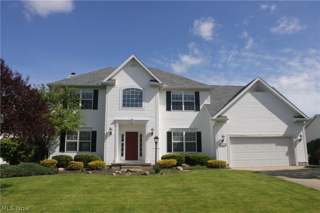Welcome Home to this 4 bed, 2.5 bath stately Colonial in the sought-after Forest Lakes development in Kent, Ohio, centrally located between Stow & Kent and the various amenities of each. This home will steal your heart with its newer roof(2018), deck(2015), updated porcelain plank flooring in kitchen/half bath/laundry(2015), original light-stained hardwood in entry/dining room & the refurbished deck-connected gazebo. When you enter the front door, you are greeted by 2-story foyer w/ landing staircase & 2nd story banistered hallway overlooking foyer. Finished bedroom over the garage is HUGE! Master bed with closet IN bedroom & another "walk-in" (unpictured) in ensuite Bath . MABA also has two vanities (1 pictured) & a shower (unpictured)! Bonus lower-level bonus room w/ wood laminate is a great office/media hang-out! Family Room adjacent to kitchen boasts gas fireplace for those cold winter nights. Beautiful yard w/ smaller plantings gives you some creative license. With back yard fence