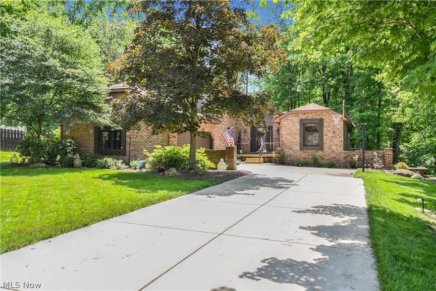 Gorgeous home located in one of Austintown’s most serene and desirable neighborhoods. This home boasts over 2600 square feet (not including basement) and offers 3 bedrooms and 4 bathrooms. The 2 story foyer showcases a wall of windows allowing for tons of natural sun light. Updated kitchen includes a center island, corian countertops , wood flooring and stainless steel appliances. The kitchen opens to a sunroom with 20 foot ceilings and also opens to the large family room with gas fireplace and built-ins.  Sliders off the family room give you access to the multi- tiered deck. The living room has detailed wall and ceiling paneling plus a built-in bar/entertainment area. The first floor is completed with a dining room, laundry room and a ½ bathroom.  Your master suite is spacious and offers a walk-in closet, dressing area and full bathroom. Two additional bedrooms and full bath complete the 2nd floor. You are going to love this basement that has been partially finished with nature stone