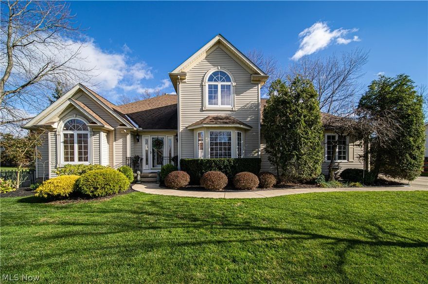 A MUST SEE ~Absolutely BEAUTIFUL, Custom Built Contemporary home in the desirable Raintree Park Development.  This exceptionally maintained 3 bedroom (1st Floor MASTER); 3.5 bath home is nestled on a one half acre lot with a pond in the back.  Bright and airy kitchen has morning room, breakfast bar and full pantry.  All kitchen appliances stay.  Formal dining room greets you as you enter the two-story foyer.  Spacious living room with gas burning fire place and skylights.  Fabulous 1st floor master suite with built in vanity and oversized walk in closet.  Master bath has glamour bath with Jacuzzi tub, walk in shower and double bowl sink/vanity.  Master bedroom and kitchen have sliders with access to the back deck.  Second floor offers 2 large bedrooms and a loft for extra space.  Elegant balcony overlooks the 2 story great room.  1st floor laundry room with new flooring, extra shelving and refrigerator.  Washer and dryer are negotiable.  Spacious finished 12 course basement has FULL li