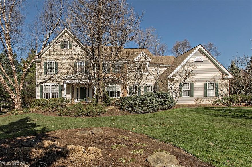 NEW PRICE! PLUS 2 brand new HVAC systems!!! Pristine colonial on a picturesque wooded lot with gorgeous views of the lake. Entry foyer leads you into a two story dramatic family room w/ walls of windows allowing an abundance of light in along with new custom built ins that flank the fireplace. Double doors lead you out to the expansive deck w/ retractable awning that is great for an entertaining space. Formal living room & dining room as well as a private office/den w/ coffered ceiling, hardwood floors and built ins as well on the first floor. A chef's dream awaits you in the gourmet kitchen ('04) w/ granite, stainless appliances, breakfast bar and loads of cabinetry. Awaiting you down the back hall is another small office area, laundry, pantry, half bath and access to a 3 car garage. Beautiful master suite on second floor has a private bath, steam shower, an oversized walk in closet second to none and a separate dressing area. 3 additional bedrooms w/ 2 full baths. Bonus loft area ups