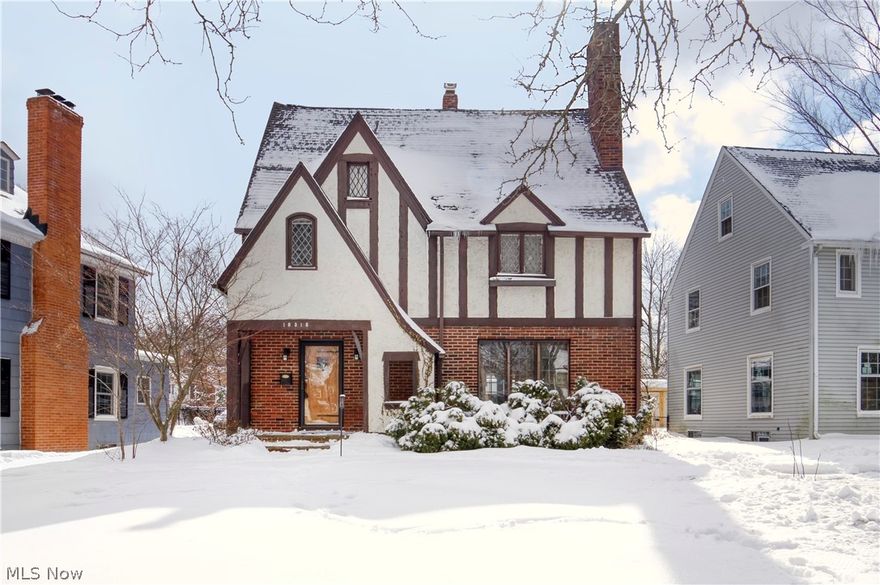 Wow, what a charmer! This classic Tudor in the fantastic Lomond neighborhood of Shaker Heights will knock your socks off. Just standing outside the front door will make you smile! Original leaded glass windows, hardwood floors, built-in cabinets and bookcases, and delightful little nooks all over the house. Terrific first floor layout connects the living room and dining room then flows to the patio to take daily life and entertaining outside. The kitchen works well for two cooks! The second floor hosts three bedrooms with surprisingly large closets and a full bath. Extend your second floor living space onto a deck installed over a new rubber roof to keep you dry on the patio; railing coming soon. Up to the amazing owner suite (an additional 532 SF!): cathedral ceilings, walk-in closet, full bath with a double vanity and heated ceramic floors! The lower level gives you two essentials: a mud room and a family room (brand new carpet). Cute yard with a fire pit hidden by the snow. House ro