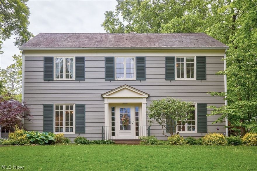 Welcome home to this unique property, conveniently located only a block away from the University, offering nature and seclusion at its finest! The beauty of this slate-roofed, colonial design is matched only by the quality and thoroughness of its construction, where finely crafted woodwork and trim abound throughout. Three warm wood-burning fireplaces grace its gathering places. A stunning, remodeled custom kitchen with custom cabinetry, Bosch Benchmark appliances, Wolf cooktop, granite countertops with a Shaw sink, and a butcher block topped center-island flows into a tile-floored and roomy family room, with an abundance of windows, natural light, and wonderful views. The remodeling continues throughout the house to include flooring, carpeting, fixtures, and the entire living room fireplace. The roomy master bedroom with beautiful views includes a bathroom. The family room carries outside to the deck and grand cedar wood pavilion, with a natural gas fueled grill, where entertainment a