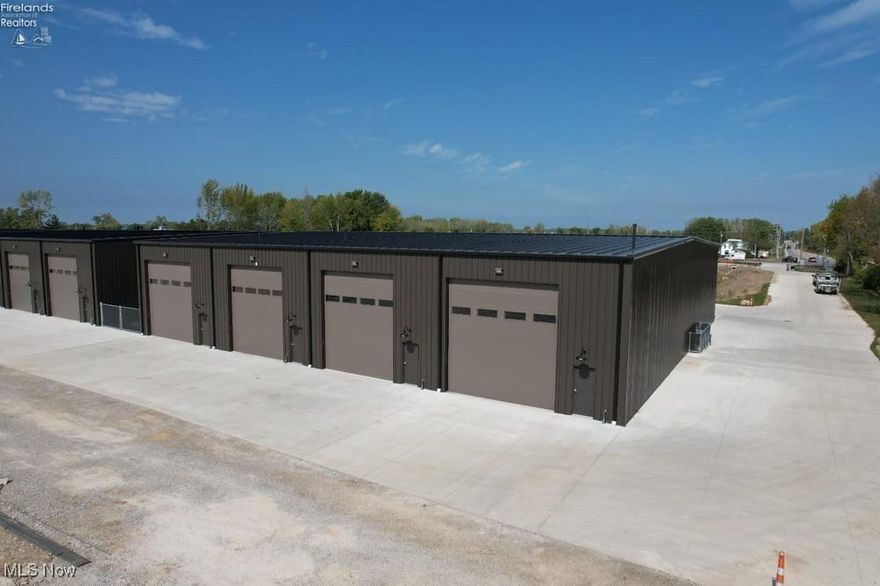 Unit C11 10/31/26 completion. 10k down reserves your spot! 23' x 53'. Welcome to Shoreline Storage Suites, Ottawa County's newest gated luxury storage campus. Located on Vacationland's main corridor, this new and growing storage community is accessible from the traffic light at SR-163 and SR-269N for easy entry/exit and is central to many boat ramps and campgrounds. New Root to Rise cafe and Soul Stretch yoga studio out front and the new Beach Glass Lounge is directly next door! Canoe club & wine bar is across the street. Down the street from East Harbor State Park and beach. A great place to store, work, and have fun too! Unit includes: 18'H x 14'W remote-controlled overhead door, 20+' ceilings, man door, ceiling fan, floor drain, R19 roof insulation, R13 wall insulation, interior metal walls, LED lighting, 70 AMP service, wall outlets, gas heat, plumbing rough-ins for full bathroom. Fenced-in 20' x 53' outside spaces ($26k) and optional lofts, bathrooms and other upgrades also available. Residential purposes prohibited. Triggered light at exit which is an important feature on this street during the summer season! Two sizes available: Smaller unit 23x53 - 139k. Larger unit 30x53 - 172k.