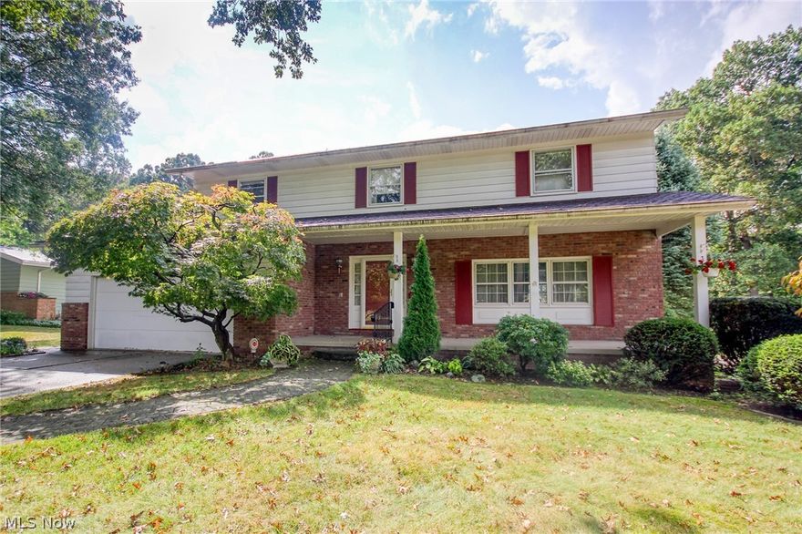 Welcome to 860 Shullo Drive. This 4 bedroom / 2.5 bath West Akron colonial has been well cared for by its one owner of 53 years and is ready for its next chapter. With 2386 square feet and a large unfinished basement there are countless possibilities for the second owner to make this home their own. Backing up to a wooded ravine that abuts the Sand Run Metro Park, this secluded gem features hardwood floors under the bedroom/family room carpet, a large master suite with full bath and three closets, an eat-in kitchen with writing desk, plenty of storage space, a cozy family room with a stone surround gas fireplace and built-ins, and a tranquil sunroom leading to a brick patio. Newer high efficiency furnace and AC unit. Washer/dryer, basement freezer, and all kitchen appliances stay.