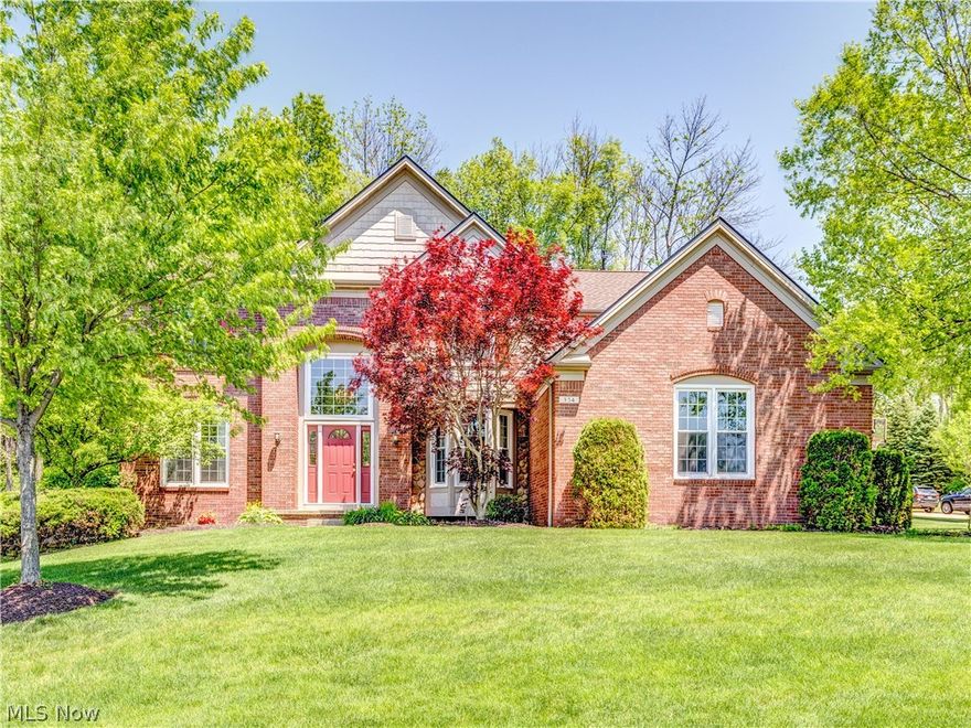 Stunning Colonial in desirable Eaton Estates. Inviting and bright 2-story Foyer Entry features a high latticed window, hardwood flooring and picture-frame molding, the same molding enhances the spindled staircase leading to the upper level. To one side of the Foyer are columns with beautiful architectural detailing leading to the elegant formal Dining Room, also with hardwood flooring, bayed windows and double tray ceiling. The Family Room is off other side of Foyer and has a see-through fireplace to the Office which is off the Living Room. The spacious Kitchen is a gourmet cook's dream, featuring an oversized range with double ovens. There are granite countertops, a ceramic backsplash and a huge center island/breakfast bar. The informal eating area in Kitchen has sliders that lead to paver patio in back. A half Bath with granite countertop and Laundry Room complete the main floor. The upstairs Owners' Suite is huge, boasting a cathedral ceiling, plant shelf, double door entry, and a d
