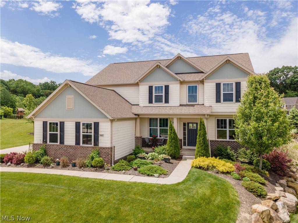 Welcome to this beautiful Jackson Township home with 3 car garage and over 1/2 acre lot. Enter the home and you are greeted by an open floor plan. There is a large open great room with hardwood floors and beautiful floor to wall windows. The great room has a beautiful stone fireplace. There is a first floor dining room which has a beautiful butlers bar with granite counter tops perfect for entertainment. The kitchen is open to the great room and the 4 season sun room which opens to a rear patio. The kitchen includes a large granite island with eat in bar. This is a chef's dream plenty of counter space and plenty of cabinets. The home includes Stainless Steel appliances and tiled back splash. There is a large sun room off the kitchen that is perfect to just relax. The home also includes a 1st floor living room off the foyer and there is also a 1st floor office area The home also includes a large 1st floor laundry. The second floor is a large master suite with hardwood flo