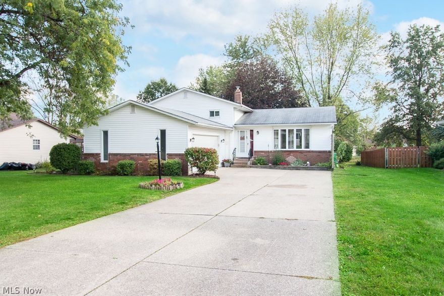 This home is move-in ready. Driving up to the home you will see the well kept yard and double driveway leading to the two car garage. Once you walk through the front door to the left there is a large front closet perfect for storage, to the right opens up into the living room that has neutral colors and a huge picture window for natural lighting. The open floor plan leads you into the dinning room with beautiful tile work in the flooring and sliding doors that allow easy access to the backyard patio and huge yard that sits on two parcels the external shed is also included. . The kitchen has multiple features including ample cabinet space for storage, gorgeous counter-tops, an island that doubles as a breakfast bar, backsplash matching the floor tiling in the kitchen and dinning room, and appliances that are included in the sale. The upper level is carpeted and is where three of the four bedrooms are located. The master bedroom on the upper level has a large closet and an entrance to th