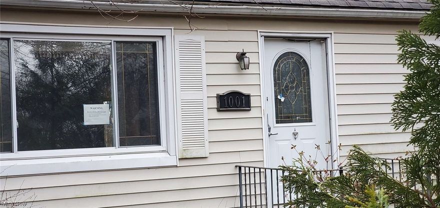 Tons of potential in this 3 bedroom cape cod in the heart of Elyria.  This home sits on almost half an acre!  Close to all amenities.  Don't miss out - Make it your own today!