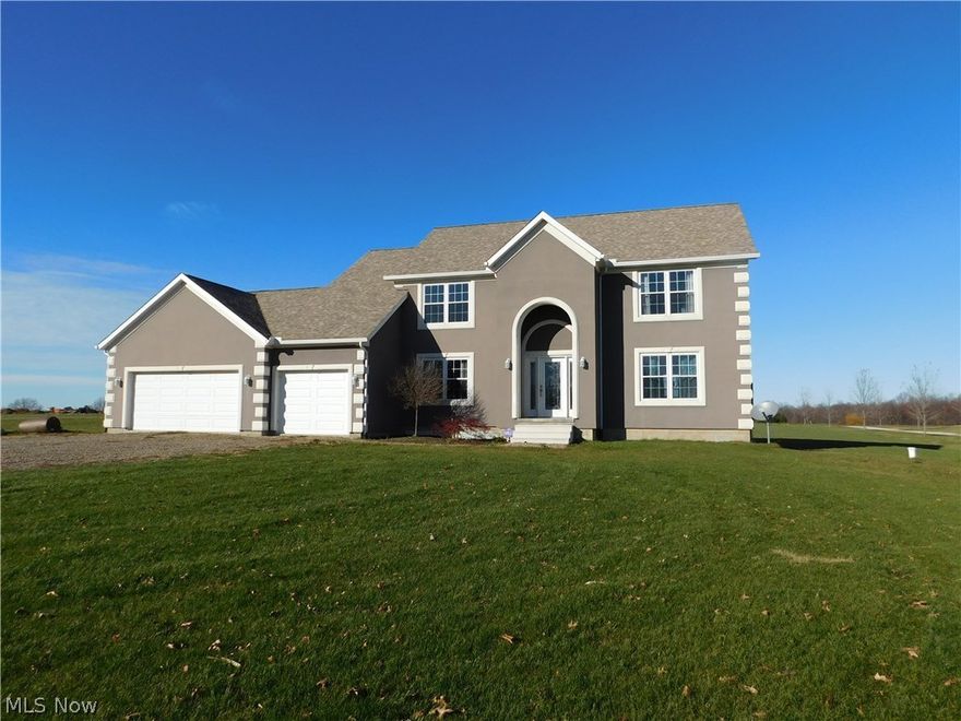 Elegant contemporary country living is  available in this 5 bedroom room home. Decorated in today's trends, the open floor plan is complimented by large rooms, wood flooring, and a large modern kitchen. Other features in include a 3 car garage, office/study, and room to expand in the unfinished lower level. The home is located on a 2.7 acre lot in Triway School District and efficiently powered by geo-thermal heat. It needs a few finishing touches to be complete!