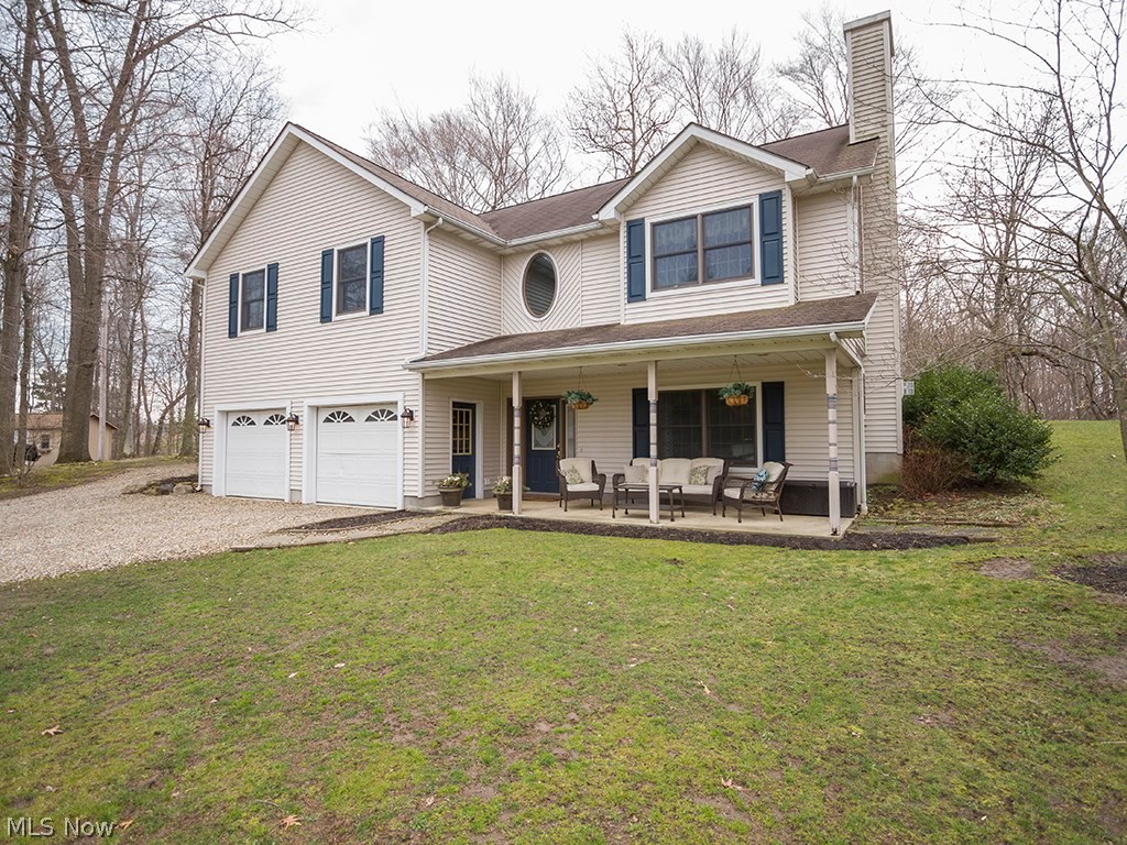 3 bedroom, 2 bath raised ranch with 2.8 acres overlooking a breathtaking wooded ravine in Norwalk Township. The main living area, including the kitchen, living room, laundry, and 2 bedrooms is on the second floor. The chef's kitchen features 2 ovens and an oversized island which holds the cook top and a prep sink. There is also a smaller second kitchen, a family room with fireplace, a third bedroom, and full bath on the lower (ground) level, which would be perfect for an in-law suite, roommate, or older children. The woodwork in this home is exquisite. The 24' X 36' heated pole barn has a cement floor, overhead doors, and 220 electric service. There is a large graveled area for plenty of extra parking for guests or toys! Parcel #310020A30560301 included.
