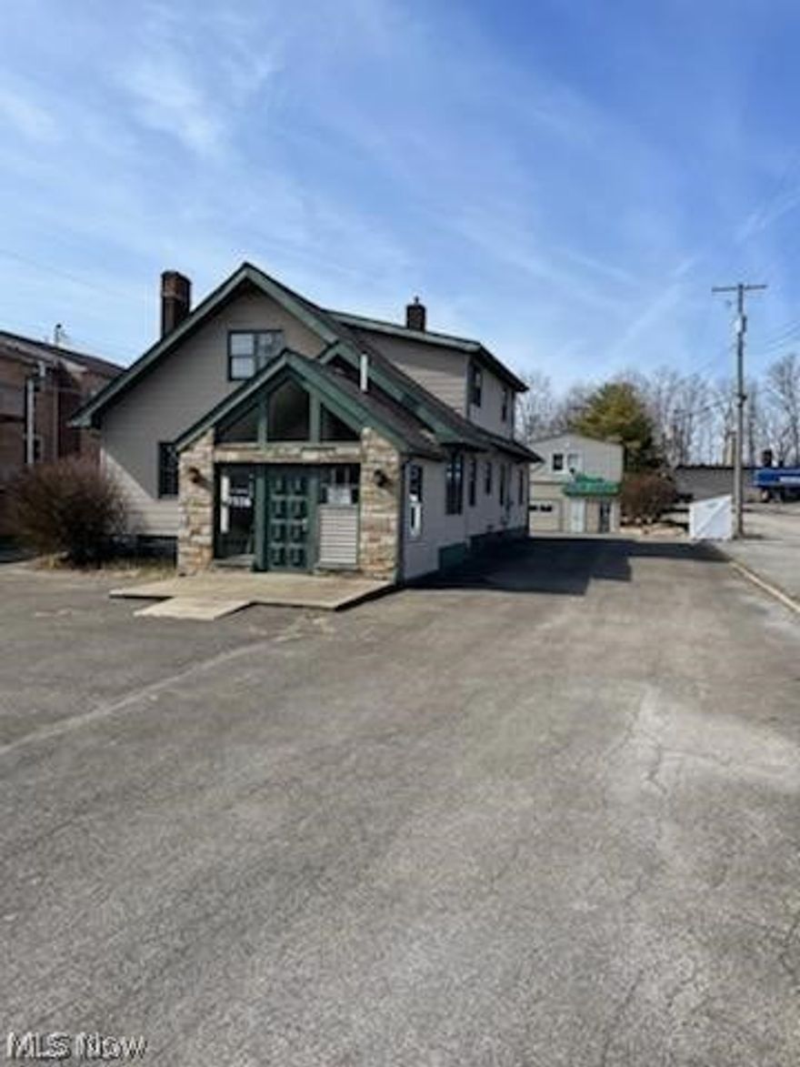 Front building has 10 offices and newer shingles and furnace. Meeting area. Set up for drive thru (2747 sq ft). Back building 500 sq ft area used for a sign shop. Plus 1 bedroom apartment for another 400 sq ft