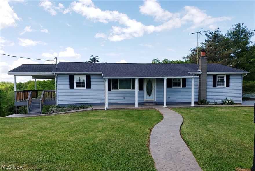 Enjoy country serenity in this ranch situated on approximately five acres.  There is an over sized one-car garage under the home.  But wait, there's more. 
Plenty of room to store your "toys" in the three-car pole barn garage.  Relax and unwind on the large covered porch that runs the entire width of the home.  Main level offers living room/dining room combination, kitchen, three bedrooms and two bathrooms.  Heated floor in main bathroom.  Downstairs, there's three rooms that could be used as bedrooms, family room, play room.  There's a full bath and laundry room on lower level.   Imagine the possibilities.  This home has gas forced air heat and central air conditioning.  Better hurry.  This one won't last long.