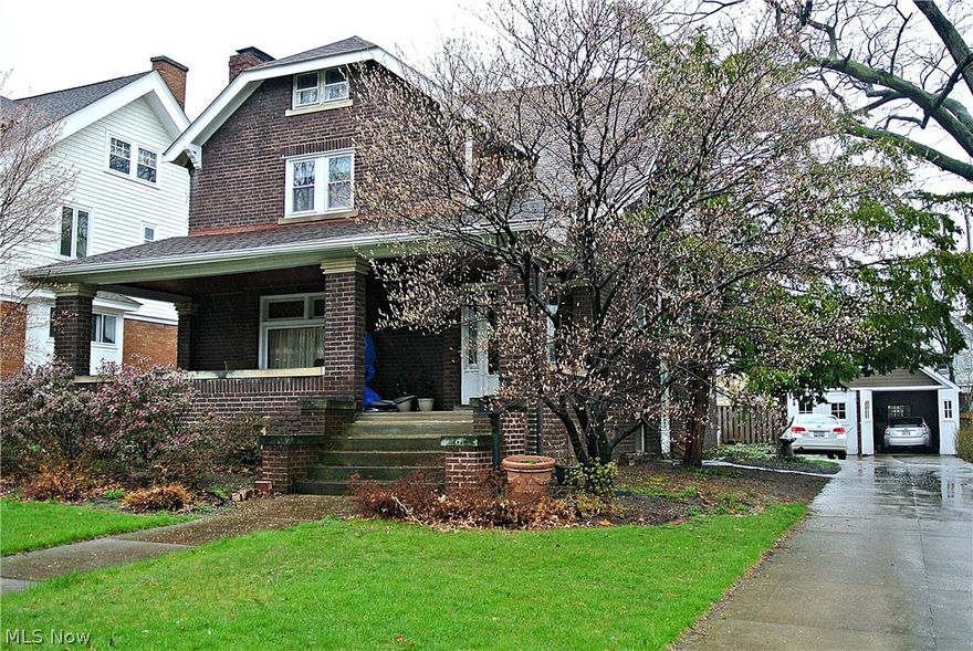 This 3 Bedroom BRICK Colonial offers all the architectural charm and rich detailing you could hope for in a Lakewood home along with updates needed for today's lifestyle. The front walk leads to a large, shady front porch. Front entry door opens to small, tiled vestibule with double set of leaded glass sidelight windows. The warm, comfortable interior is accented by hardwood floors, high ceilings with crown moldings, and built-in cabinetry. Windows in the entry, living room and dining room feature sparkling beveled glass. Kitchen has been updated with modern lighting, oak cabinets, and newer appliances that stay. A back mud room with closet and half bath was added at the time of kitchen remodel. Gorgeous wood staircase accesses the second floor's spacious upper hall with built-ins and extra closet. Master bedroom features ceiling fan and walk-in closet. Full bath has been updated. 2nd bedroom has door to old-fashioned sleeping porch. Unheated bonus room makes great walk-in closet or st