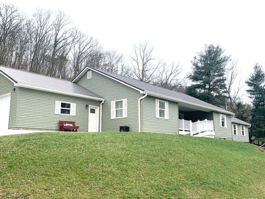 A Very Unique property offering a 3 Bedroom, 2.5 bath ranch home built in 2019. Handicap accessible. Home features 2 large master bedrooms, each with private bath and walk in shower. Great room with vaulted ceiling is open to the kitchen & dining area! Total one floor living with 1/2 bath & laundry room. This home features a separate recreation area with bath accessible through the breezeway. Property also includes a 1998 Single Wide Trailer currently rents for $725/month   
Perfect for additional family members to live in or continue to can be used as a rental property. The home features a large two car garage with concrete driveway and two outbuildings.  Home & trailer are in great condition.