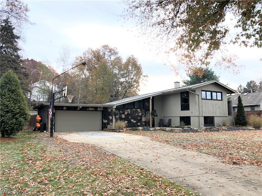 Truly one-of-a-kind!  Welcome home to 3865 Baymar Drive.  Nestled in the Cornersburg area of the West Side, this unique split level will check off all the boxes.  The current owner has spent the last 4 years updating and renovating nearly every part of this home.  On the main level, an open and airy entryway will greet you each time you walk through the door.  A cathedral style great room/living room features oversized windows custom laid tile planks and built-in audio/video equipment.  Step down in the lower level and you will enter the cozy family room with custom built entertainment area which opens in to the kitchen.  The eat-in kitchen features custom epoxy countertops, LED lighting, and stainless steel appliances.  Upstairs are the 3 bedrooms, all with original hardwood floors, the main bath, and a unique office nook area overlooking the living room.  Tons of updates and fixes to list including:  new furnace (2015), new roof (2017), new carpet, new tile, door to garage added, mod