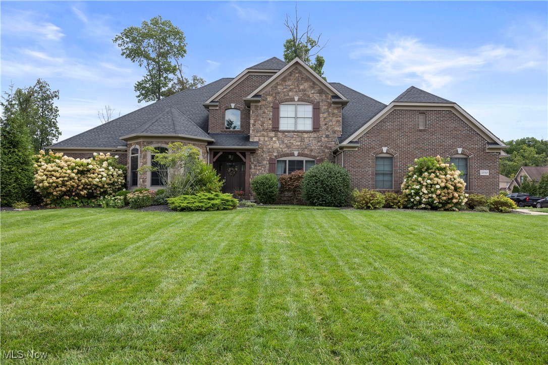 Luxury custom-built Edgewood home in Timberlane Estates! Former model boasting over 5,000 sq. ft. of living space with today's finest design features spread across 4 bedrooms and 4.5 bathrooms. Impressive great room with decorative beam ceilings and floor-to-ceiling stone fireplace. Gourmet kitchen with oversized island, custom cabinetry, stainless steel appliances, double wall ovens, cooktop, and walk-in pantry. First-floor master suite with tray ceiling, spa-like bath, and oversized custom-tiled shower. Main floor laundry/mudroom with lockers and cabinetry. Finished lower level adds even more living and entertaining space along with a full bath. Covered stamped concrete patio overlooks the spacious half-acre+ lot. Oversized 3-car garage. Highly sought-after location! Don't miss this rare opportunity!