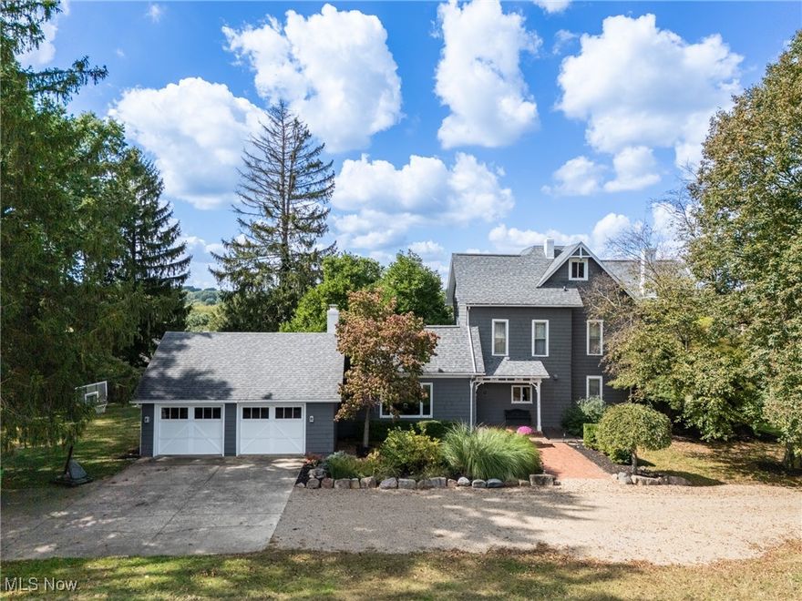 Experience the perfect blend of space, character, and location at 1315 E Milltown Road. Situated on a rare .74-acre lot within city limits, this home is rich with charming details like hand-carved doors, hardwood floors, and 10' ceilings. The main floor offers an abundance of living space, including a sun-filled hearth room, a large country kitchen, a formal dining room, and a bright living room with alcove windows. A multipurpose/office room with built-in shelving provides a quiet retreat, while a versatile first-floor bedroom, full bath, and laundry room add modern convenience. The main floor is complete with a newly added ½ bath. The second floor features four generously sized bedrooms with excellent closet space and another full bathroom. Key updates provide confidence in your investment: the roof is under 7 years old, and the boiler is under 5. Central air was also added in 2024. The property also features a 2-car attached garage, mature gardens, and two storage sheds, one of which is equipped with gas and electricity. This is a unique opportunity to own a piece of paradise in the city.