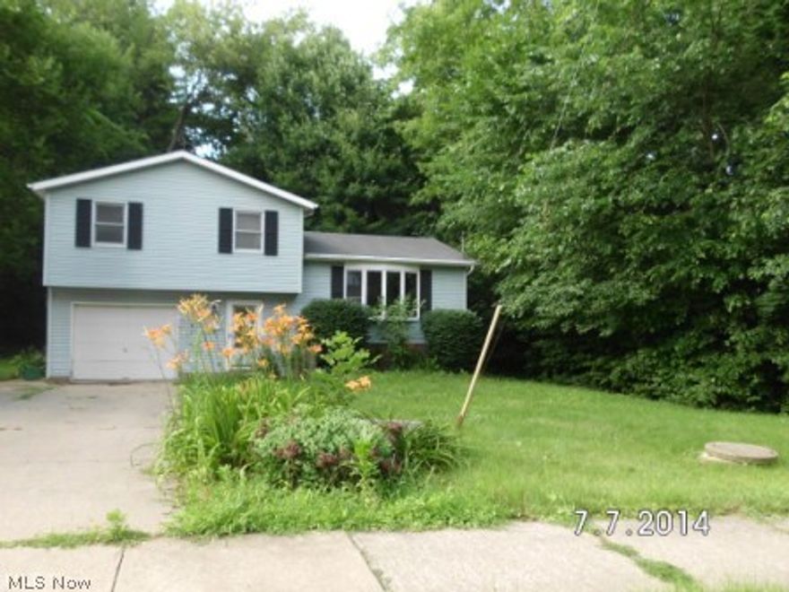 Split-level, with 3 brms and 2 baths, and a rec rm in the lower level. Sit on your deck and enjoy the wooded view while you relax.