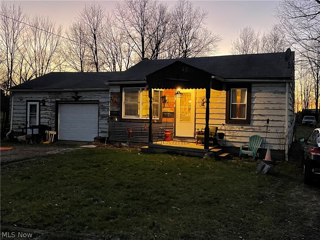 Do you love summer sunrises and sunset because this place has it! Bring your own ideas to finish the home. Living room, Kitchen and Bath have been nicely updated with new walls, plumbing, electrical and insulation. The two bedrooms have been reconfigured into one large room with a large closet , and office nook. Attached garage is heated and the laundry room is off garage. There is also a nice workshop with an outside door off the garage. Yard is wooded and partially fenced in the back. There are miscellaneous out buildings too. Updates include: 2021 septic repairs, 2020 Kitchen new cabinets, sink ,countertops and appliances. Living room walls and floors, 2019 new hot water tank, Water pressure tank ,and well pump. 2018 Bathroom gutted and all brand new. House is being sold AS- IS. Seller will not do any repairs. Inspections for buyers knowledge only.